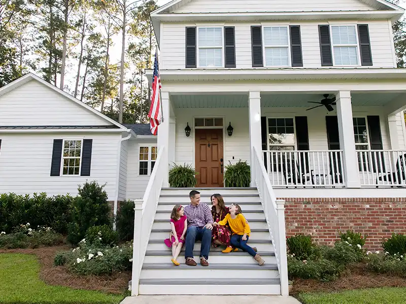 Family together in front of home